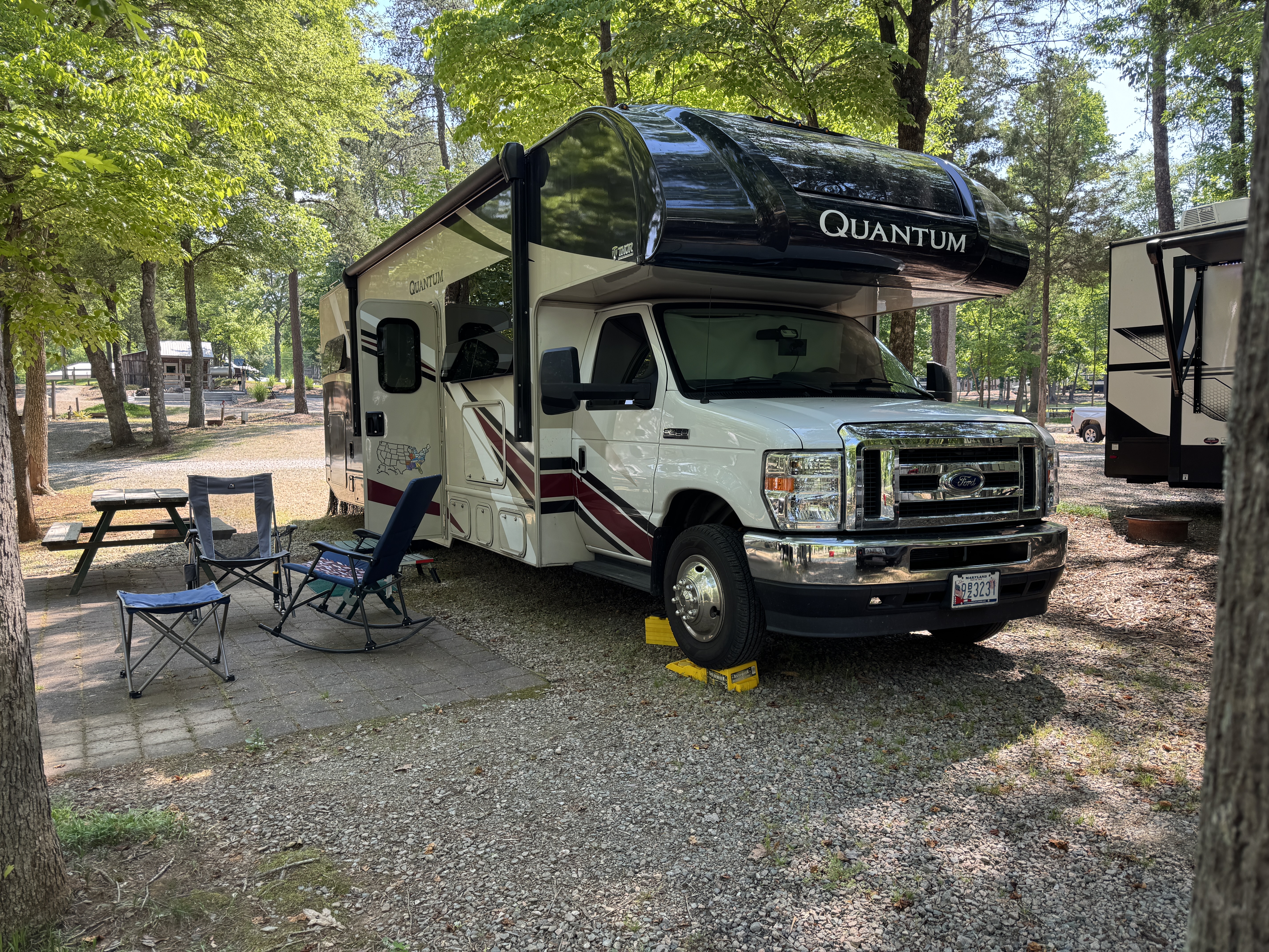 Class C motorhome parked at a campsite